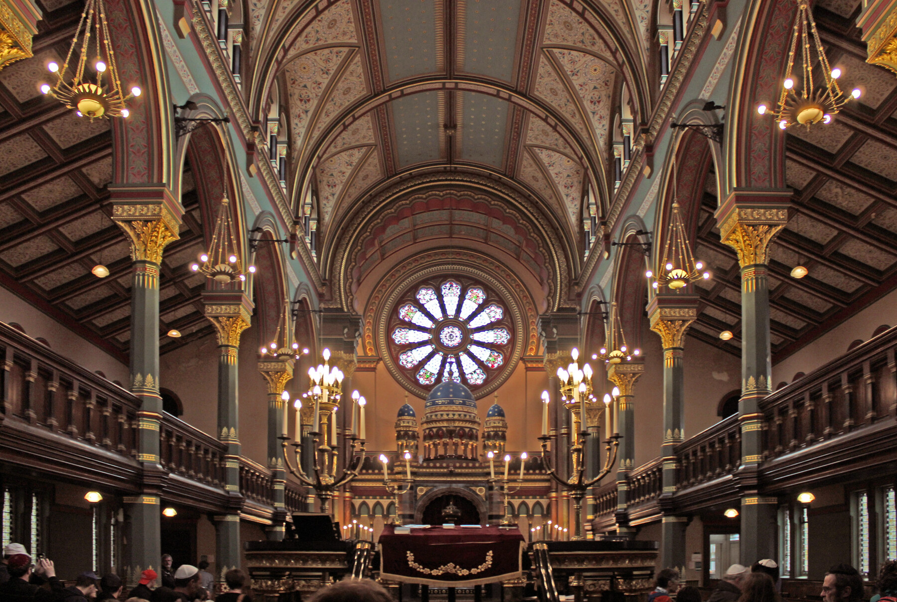 The richly decorated nave of Princes Road Synagogue, viewed northeast towards the Ark beneath a rose window.