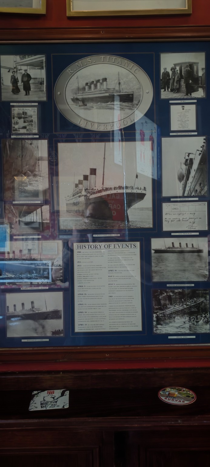 Tall Titanic display in Cobh containing photographs, documents and the R.M.S. Titanic — Liverpool panel.