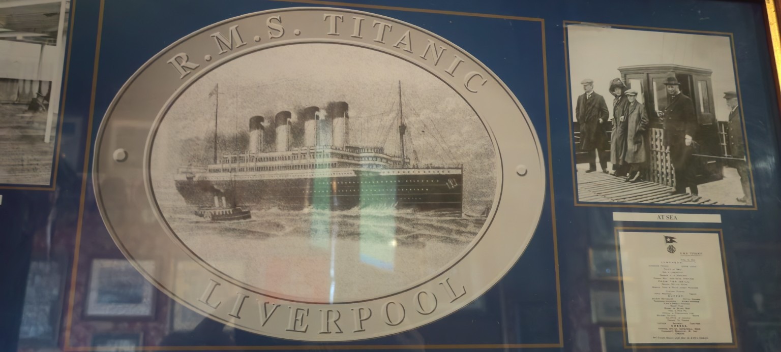 R.M.S. Titanic — Liverpool display panel with a historic image of the liner at sea.